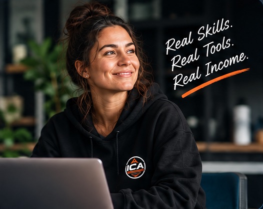 An ICA Pro member smiling at her laptop, wearing an ICA hoodie. Real Skills. Real Tools. Real Income.